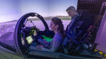 Princess of Wales sits in the cockpit of an RAF Typhoon jet simulator during her visit to RAF Coningsby (Picture: PA)