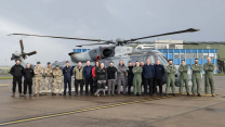 UK trials crew with Wildcat from 815 Naval Air Squadron behind them