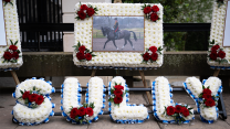 Floral tributes spell out "Sully", the name LBdr Sullivan was called by friends 