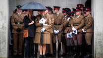 Members of the Royal Horse Artillery watch as the coffin of Lance Bombardier Ciara Sullivan carried from the Guards Chapel (