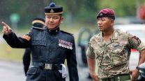 A senior NCO from The King's Gurkha Artillery discusses proceedings with a WO1 from The Royal Gurkha Rifles ahead of the formation parade of the KGA - the Brigade of Gurkhas' newest unit