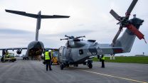Before the Wildcats can be loaded on board the C-17, they need to be prepped for transit, the most obvious bit of work being the removal of the main rotor blades