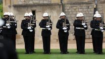 Royal Marines slope arms with their assault rifles - the Corps operates the  Knight's Armament KS-1 alongside the SIG Sauer MCX (Picture: MOD)