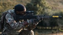 Corporal Sudan takes aim with his SA80 L85A2 - Royal Signals personnel are experts in engineering and operating systems, networks and cyber equipment, but their "green Army" skills need to be exemplary too
