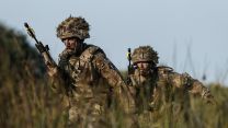 Lance Corporal Forsyth and Signaller Crabbe advance through the tall grass - this will provide some cover from view, but in a real life scenario no protection from incoming rounds