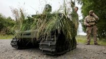 A Gereon uncrewed ground vehicle, an autonomous tracked utility vehicle used to observe targets, is demonstrated by soldiers from 1st Battalion, The Royal Anglian Regiment on Exercise Viking Strike