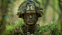 Private Bishop from 1st Battalion The Royal Anglian Regiment wears full camouflage and Tactical Engagement Simulation kit during Exercise Viking Strike on Otterburn training area in Northumberland
