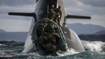 Soldiers from 148 (Meiktila) Commando Forward Observation Battery board a German submarine as they practise their float-on float-off drills off the coast of Cape Wrath