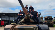 The sailors pose on the tanks turret