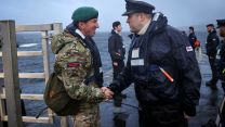 First Sea Lord General Sir Gwyn Jenkins went aboard to personally welcome the submariners home