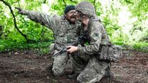 A Rifles WO2 shouts instructions to a competitor at the start of the sword lane - this technique gets the adrenaline pumping and focuses the infanteers on the task ahead