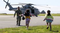 Children run to their father who has just returned from an air defence mission in Cyprus (Picture: MOD)