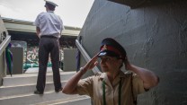 Private Richards adjusts her hat before going to her post on Centre Court