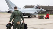 An RAF pilot approaches his Typhoon aircraft at RAF Coningsby, joining those already deployed in Qatar in the wake of Iranian reprisal attacks