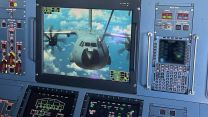 A crew member on board the Voyager keeps a close eye on a monitor as the A400M takes on fuel during its long flight to and from Ascension Island