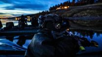 A Royal Marines Commando checks his arcs of fire before a beach landing in northern Norway (Picture: MOD) A Royal Marines Commando checks his arcs of fire before a beach landing in northern Norway