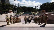 Princess Anne is escorted by the Chief of Army, Lieutenant General Simon Stuart AO DSC, to the Anzac Memorial in Hyde Park, Sydney, during the Remembrance Sunday Service