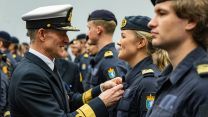 A Norwegian sailor is presented with a medal after the deployment 