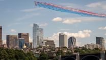 With the symbolic trail lighting up the skies during the Sail Boston maritime event