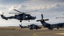 Royal  Navy Wildcat HMA2 helicopters from 815 Squadron land at RAF Akrotiri - they've been deployed to Cyprus where their Martlet missiles can be used to take down hostile drones