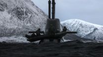 In the fjords of Norway, Commandos cling onto a German U-35 attack submarine 