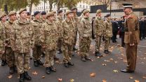 A Coldstream Guards Warrant Officer ensures Army and Sea Cadets form up correctly at the Cenotaph