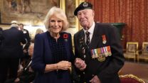 Queen Camilla and veteran Henry Rice at a reception for veterans who served in Pacific during WW2, part of commemorations marking the 80th anniversary of VJ Day, at Windsor Castle
