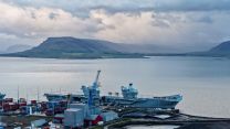 The 65,000-tonne aircraft carrier surrounded by shipping containers (Picture: HMS Prince of Wales X)