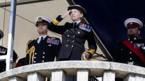 Rear Adm Singleton acknowledges the passing out cadets from the Dartmouth dais (Picture: Royal Navy)