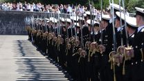 The newly-commissioned officers hold their ceremonial swords (Picture: Royal Navy)