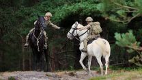 Map reading from the saddle will be a vital skill to master should these soldiers ever have to carry out a mounted reconnaissance mission in wartime