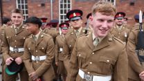 Royal Yorkshire Regiment infanteers share a joke as they prepare to form up for a parade at Imphal Barracks to mark the 20th anniversary of the creation of the regiment (Picture: BFBS)