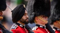 While all five regiments of the Foot Guards are known for their bearskin caps, not all those formed up among the Grenadier Guards were wearing one
