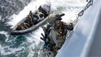 By sea, the commando's made entry onto FGS Berlin using caving ladders