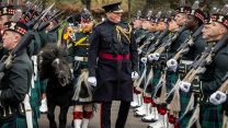 The Household Division's Brigade Major, Lieutenant Colonel Charles Foinette, is joined by Royal Regiment of Scotland mascot Cruachan IV and Pony Major Rory Walker during the inspection
