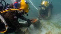A US Navy diver works alongside a Royal New Zealand Navy diver during a salvage training dive at Joint Base Pearl Harbor-Hickam