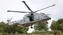 A Merlin Mk4 hovers during the exercise (Picture: Royal Navy)