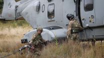 CHF's Aviation Combat Service Support Squadron get into position to refuel a Merlin Mk4 (Picture: Royal Navy)