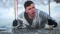 Personnel conduct ice-breaking drills at the end of the Cold Weather Aviation Operator Course during Operation Clockwork in Bardufoss