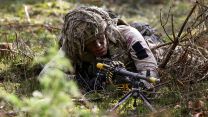 An infanteer from 2nd Battalion, The Royal Anglian Regiment sets up his General Purpose Machine Gun, loaded with a belt of blank 7.62x51mm ammunition, during Operation Cabrit in Poland