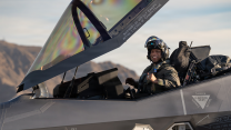 A US Air Force pilot assigned to the 95th Fighter Squadron opens the canopy of an F-35A Lightning