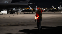 A crew chief, assigned to the 325th Fighter Wing, Tyndall Air Force Base, Florida, conducts final checks before a night mission during Red Flag 