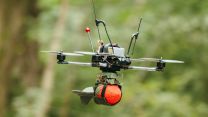 A first-person view drone flies towards an enemy position carrying a dummy munition during the British Army tactical drone championship at Royal Military Academy Sandhurst