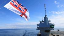 The White Ensign flies from the forward tower of HMS Prince of Wales as the flagship takes part in Dynamic Mongoose 26 - Nato's premier anti-submarine warfare exercise held in the High North and North Atlantic