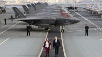 The pair walked the flight deck as the ship anchored off the coast of Naples, Italy