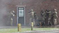 1st Battalion The Royal Irish Regiment prepare to storm a building.