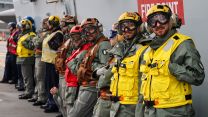 Italian personnel line the deck of HMS Prince of Wales as Italian F-35Bs join their British counterparts on board the Royal Navy flagship