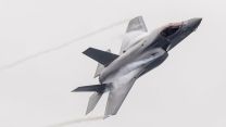 An F-35B Lightning makes a flypast of the UK Carrier Strike Group having taken off from the flagship, HMS Prince of Wales