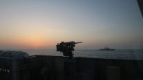 Sun sets over HMS Trent shadowing Russian warship