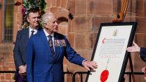 King Charles reads the Commissioning Warrant at a formal ceremony to mark HMS Agamemnon entering operational service 